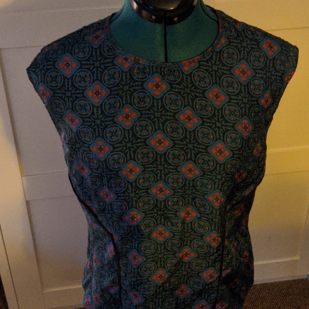 Patterned cap sleeve blouse with back cutout